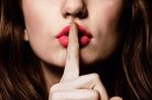 woman-with-finger-on-lips